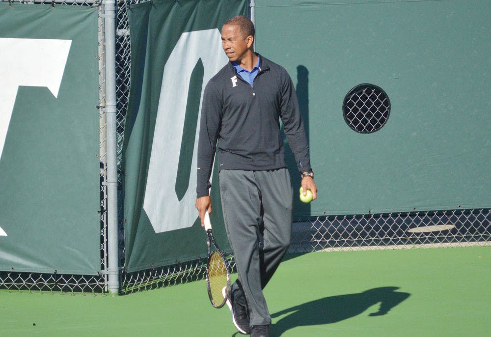 <p>UF men's tennis coach Bryan Shelton walks on the Ring Tennis Complex courts prior to Florida's 5-2 win against North Florida on Jan. 22</p>