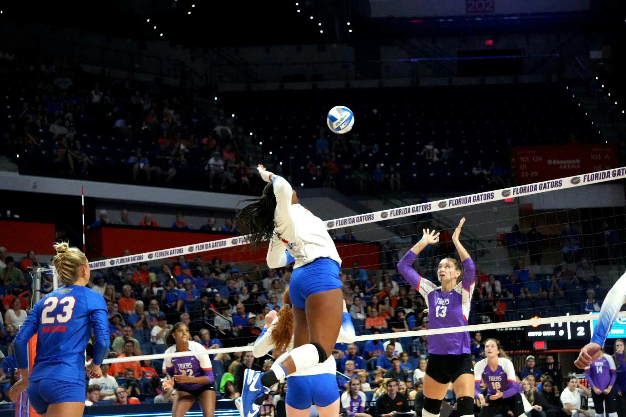 Junior middle back Gabrielle Essix prepares to block the hit the ball in the Gators' 3-0 win against the Clemson Tigers Friday, Sept. 8, 2023.