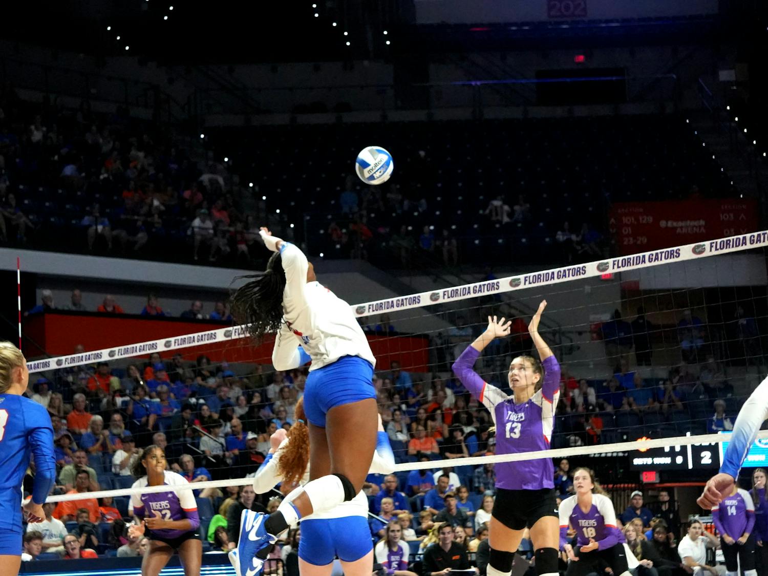 Junior middle back Gabrielle Essix prepares to block the hit the ball in the Gators' 3-0 win against the Clemson Tigers Friday, Sept. 8, 2023.