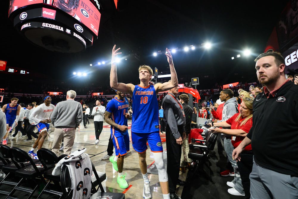 Florida forward Thomas Haugh (10) hypes up the crowd as the Gators walk off the court after an NCAA college basketball game against Georgia, Wednesday, Feb. 11, 2026, in Athens, Ga.
