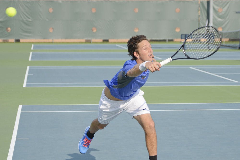 Gordon Watson dives for a missed return during Florida's win against LSU on Friday.