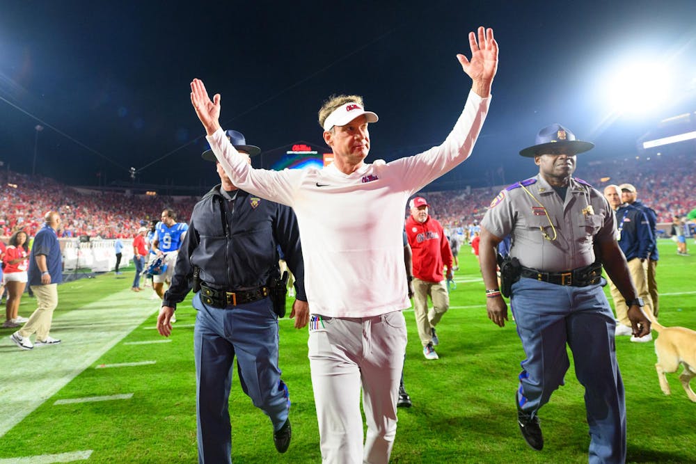 Ole Miss head coach Lane Kiffin raises his arms to the crowd after a win in an NCAA college football game, Saturday, Nov. 15, 2025, in Oxford, Miss.