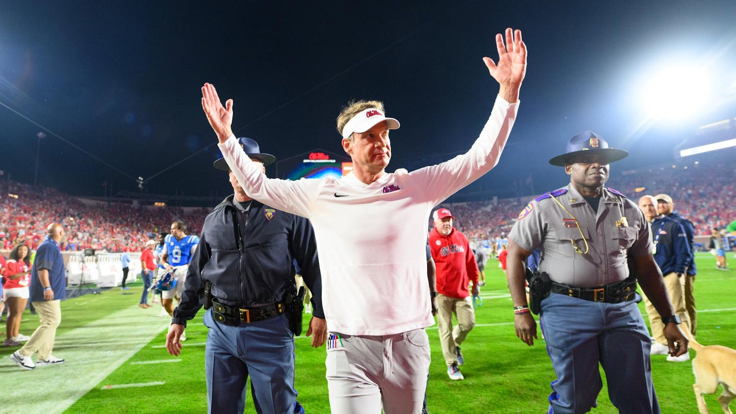 Ole Miss head coach Lane Kiffin raises his arms to the crowd after a win in an NCAA college football game, Saturday, Nov. 15, 2025, in Oxford, Miss.