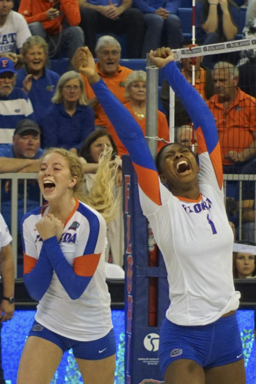 <p>UF's Carli Snyder (left) and Rhamat Alhassan celebrate during Florida's 3-0 win against New Hampshire Dec. 3, 2015, in the O'Connell Center.</p>