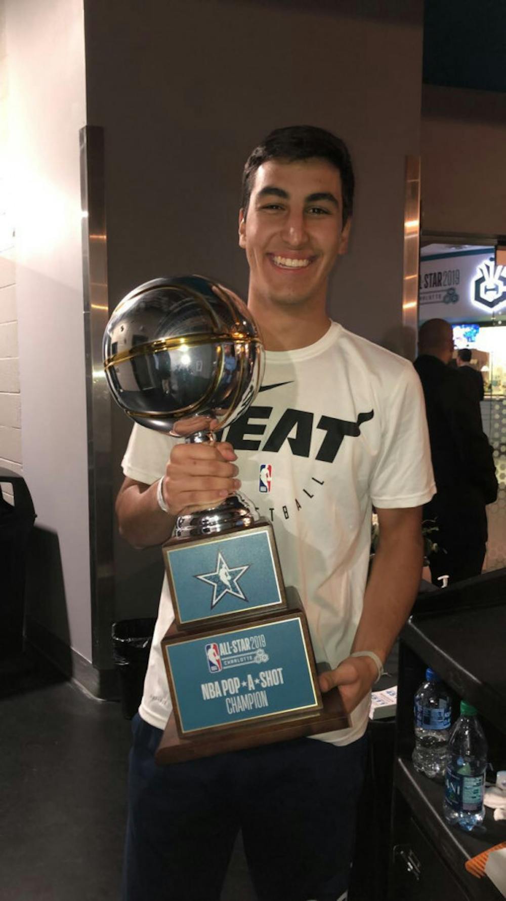 <p>Victor Prieto poses after winning the NBA's first Pop-A-Shot Championship at All-Star Weekend.</p>