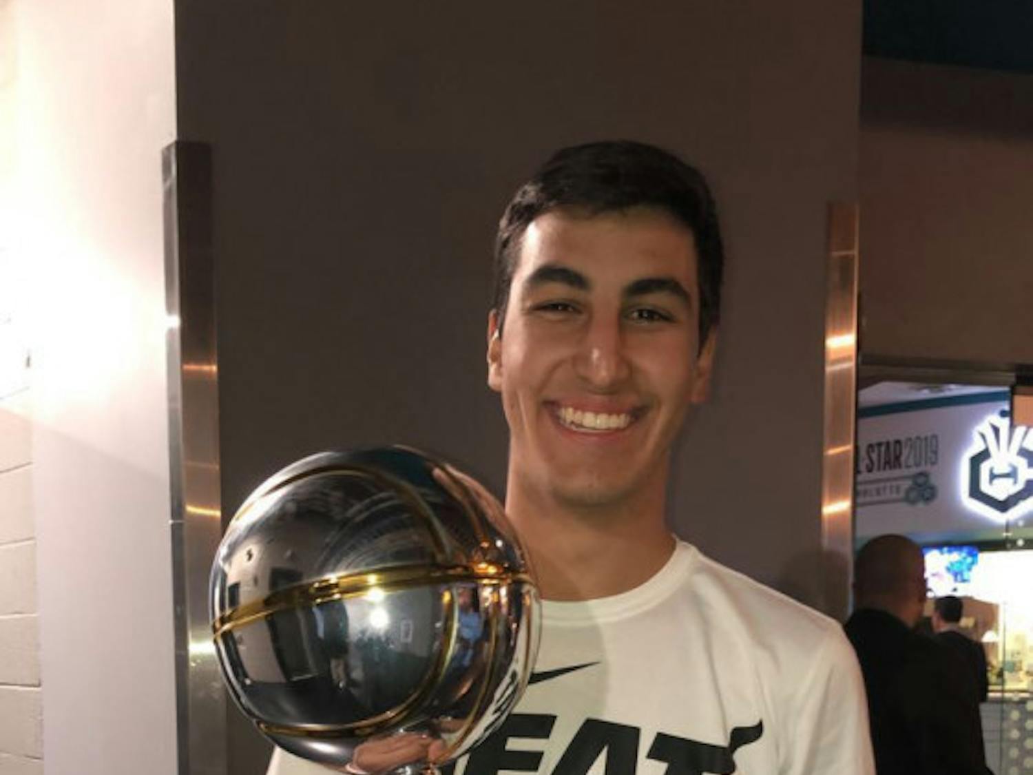 Victor Prieto poses after winning the NBA's first Pop-A-Shot Championship at All-Star Weekend.