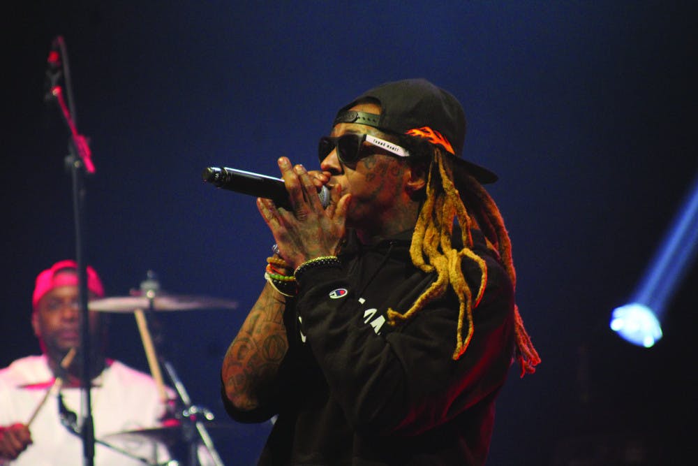 <div class="page" title="Page 1"><div class="layoutArea"><div class="column"><p><span>Rapper Lil Wayne performs at the O’Connell Center on Tuesday evening. </span></p></div></div></div>