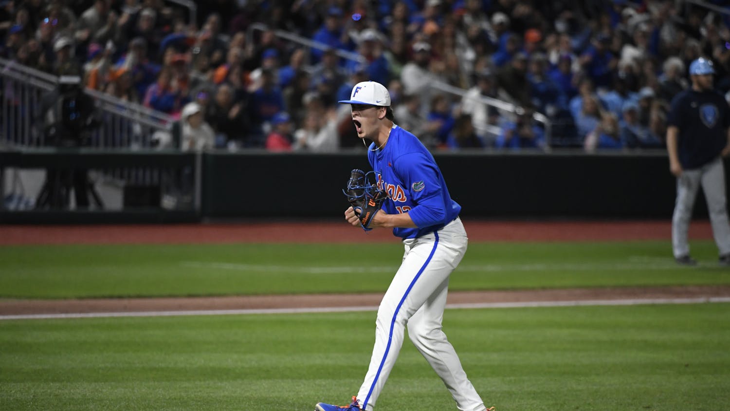 Florida baseball freshman right-handed pitcher Liam Peterson shows emotion after escaping a jam in the fourth inning of the team's game against Columbia University on Saturday, February 24, 2024. 
