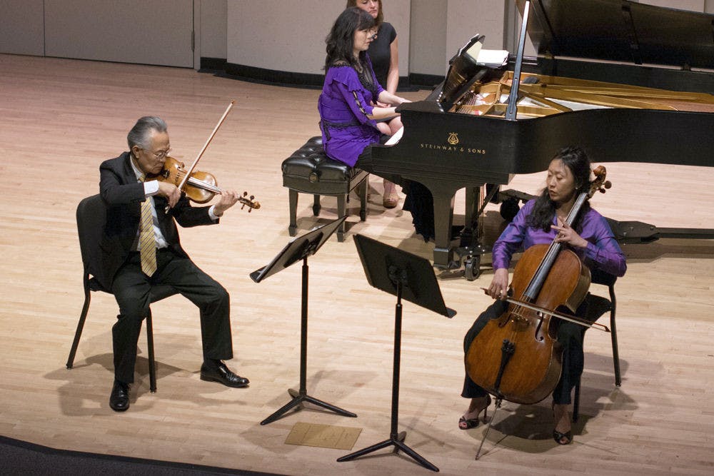 Violinist Sungrai Sohn, pianist Tammy Lum and cellist Chungsun Kim perform the "Master's Touch" in the Music Building on Tuesday night.