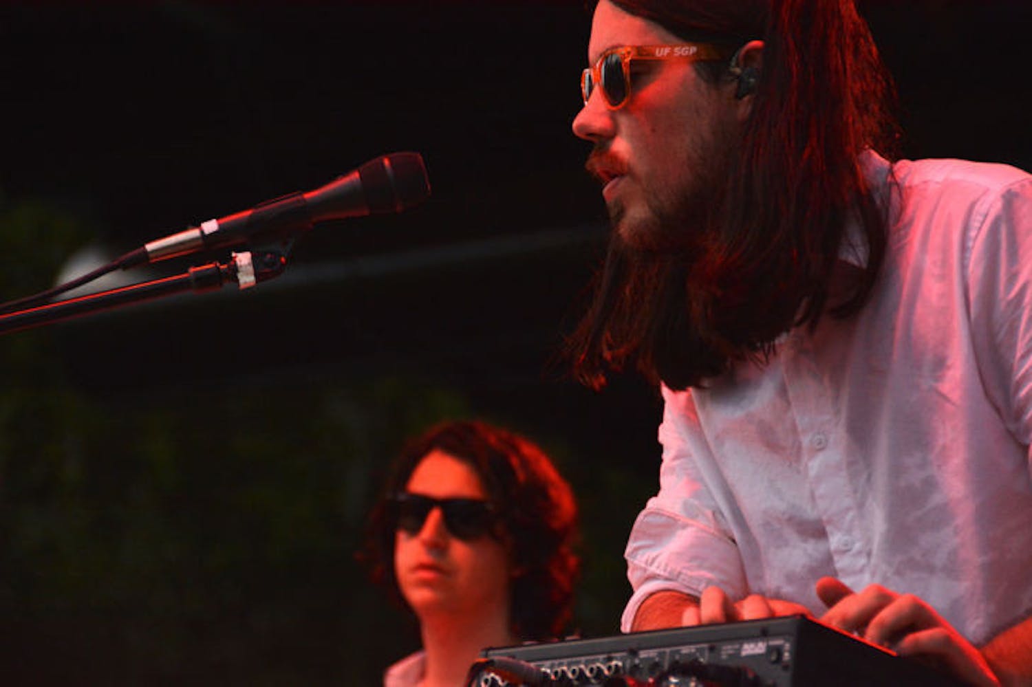 Brian Oblivion, of Cults, performs on Friday during Swampfest 2013. Cults opened, along with the band AHMIR,&nbsp;for Matt and Kim, whose performance was canceled due to thunderstorms.