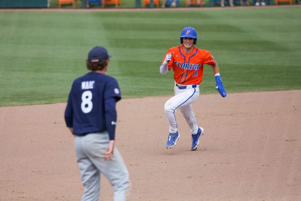 Florida outfielder Michael Robertson runs toward third base during the Gators' 17-8 victory against the Auburn Tigers Sunday, April 2, 2023.