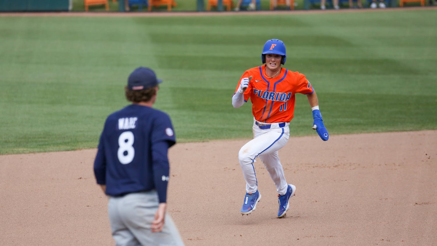 Florida outfielder Michael Robertson runs toward third base during the Gators' 17-8 victory against the Auburn Tigers Sunday, April 2, 2023.