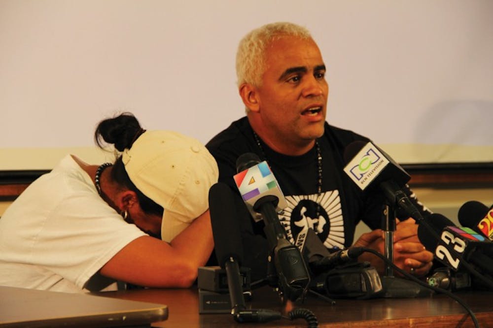 <p>Claudia Aguilar sobs on her husband, Carlos, as he addresses reporters during a news conference at the University Police Department on Saturday evening. What are possibly the remains of missing UF student Christian Aguilar were found Friday afternoon deep in the woods of a hunting reserve in Levy County.</p>
