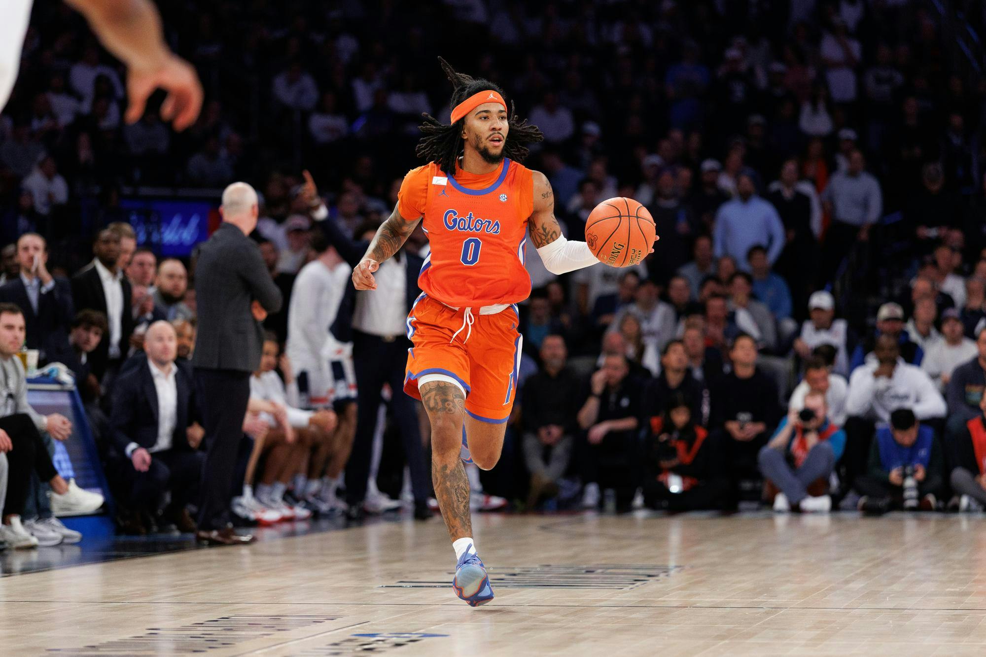 Florida Gators guard Boogie Fland (0) dribbles down the court during the second half of an NCAA college basketball game between Florida and UConn on Tuesday, Dec. 09, 2025, in New York, N.Y.