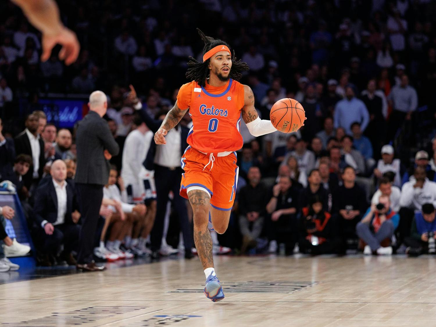 Florida Gators guard Boogie Fland (0) dribbles down the court during the second half of an NCAA college basketball game between Florida and UConn on Tuesday, Dec. 09, 2025, in New York, N.Y.