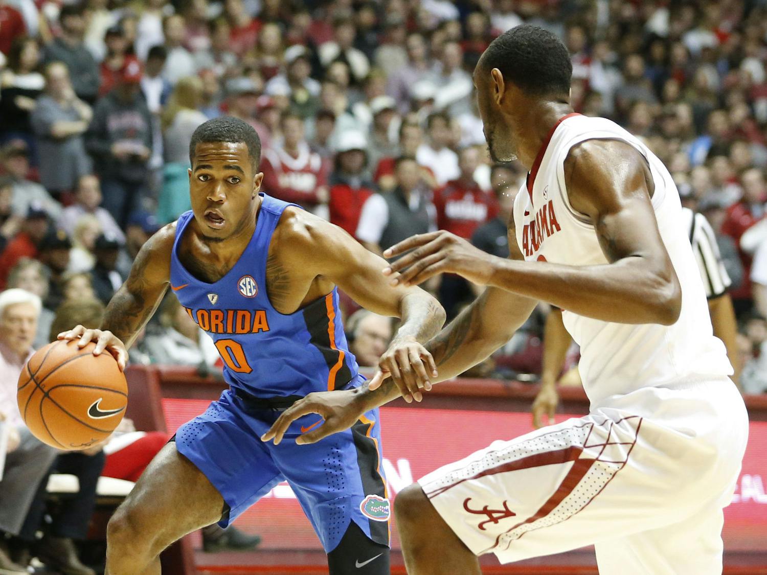 Florida guard Kasey Hill drives the ball against Alabama forward Jimmie Taylor during the first half of an NCAA college basketball game, Tuesday, Jan. 10, 2017, in Tuscaloosa, Ala. (AP Photo/Brynn Anderson)