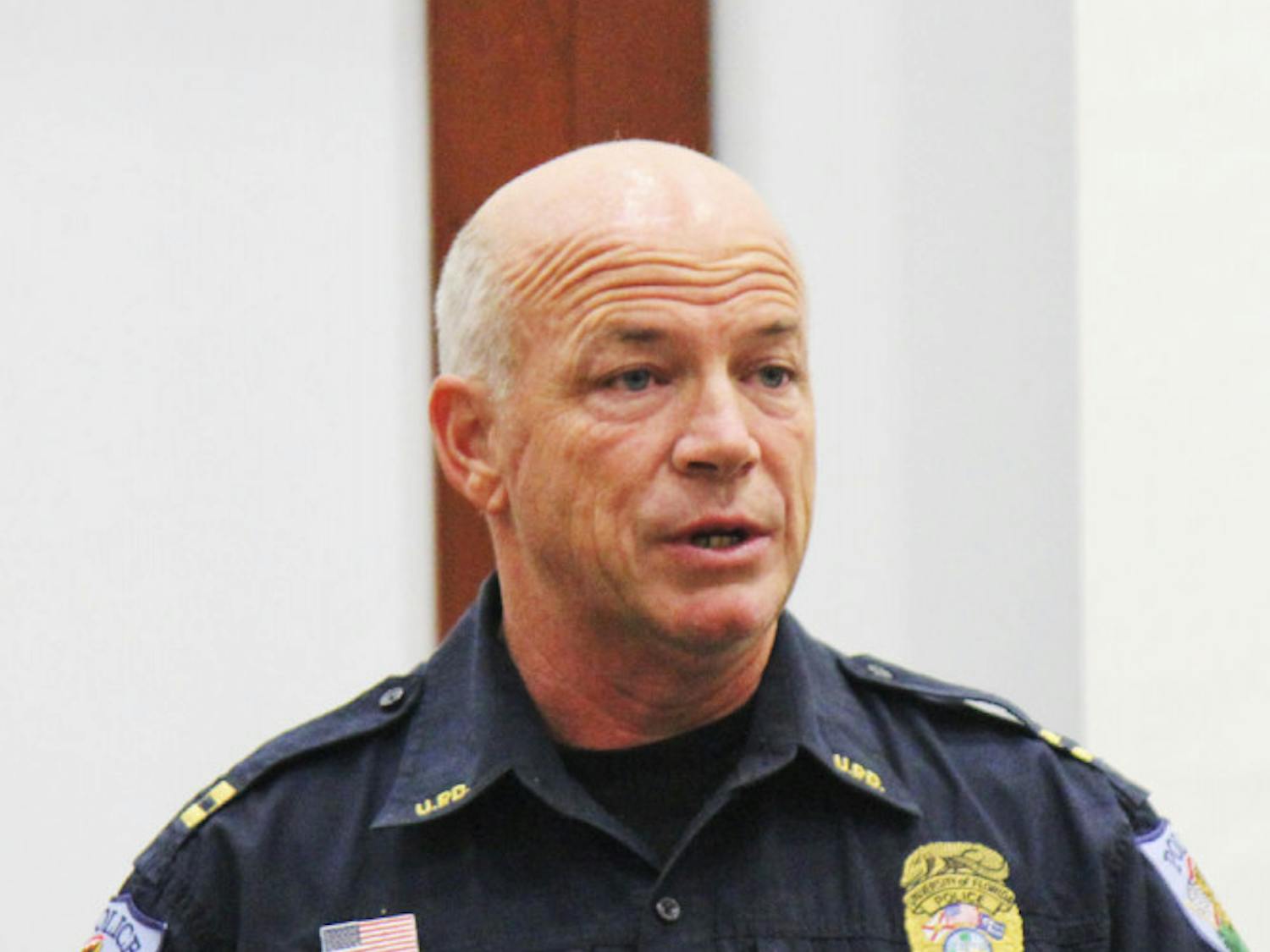 University Police Capt. J.J. Holcomb announces to the UF Student Senate on Tuesday that if approved, Student Nighttime Auxiliary Patrol vans available will double to eight to reduce wait time and increase the system’s efficiency. 