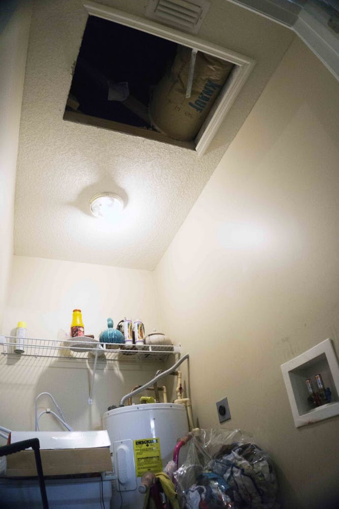 Pictured is the opening to the attic in Ifeyiek Akanni's home, where fugitive Victor Lamar Cruger reportedly hid while authorites searched the house Aug. 28, 2015.