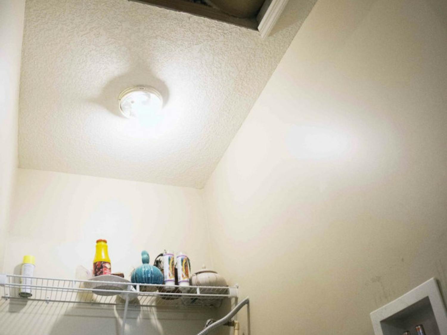 Pictured is the opening to the attic in Ifeyiek Akanni's home, where fugitive Victor Lamar Cruger reportedly hid while authorites searched the house Aug. 28, 2015.