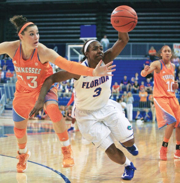 Guard January Miller (3) fights for possession with guard Taber Spani (13) during Florida’s 78-75 overtime loss to Tennessee on Sunday in the O’Connell Center.
