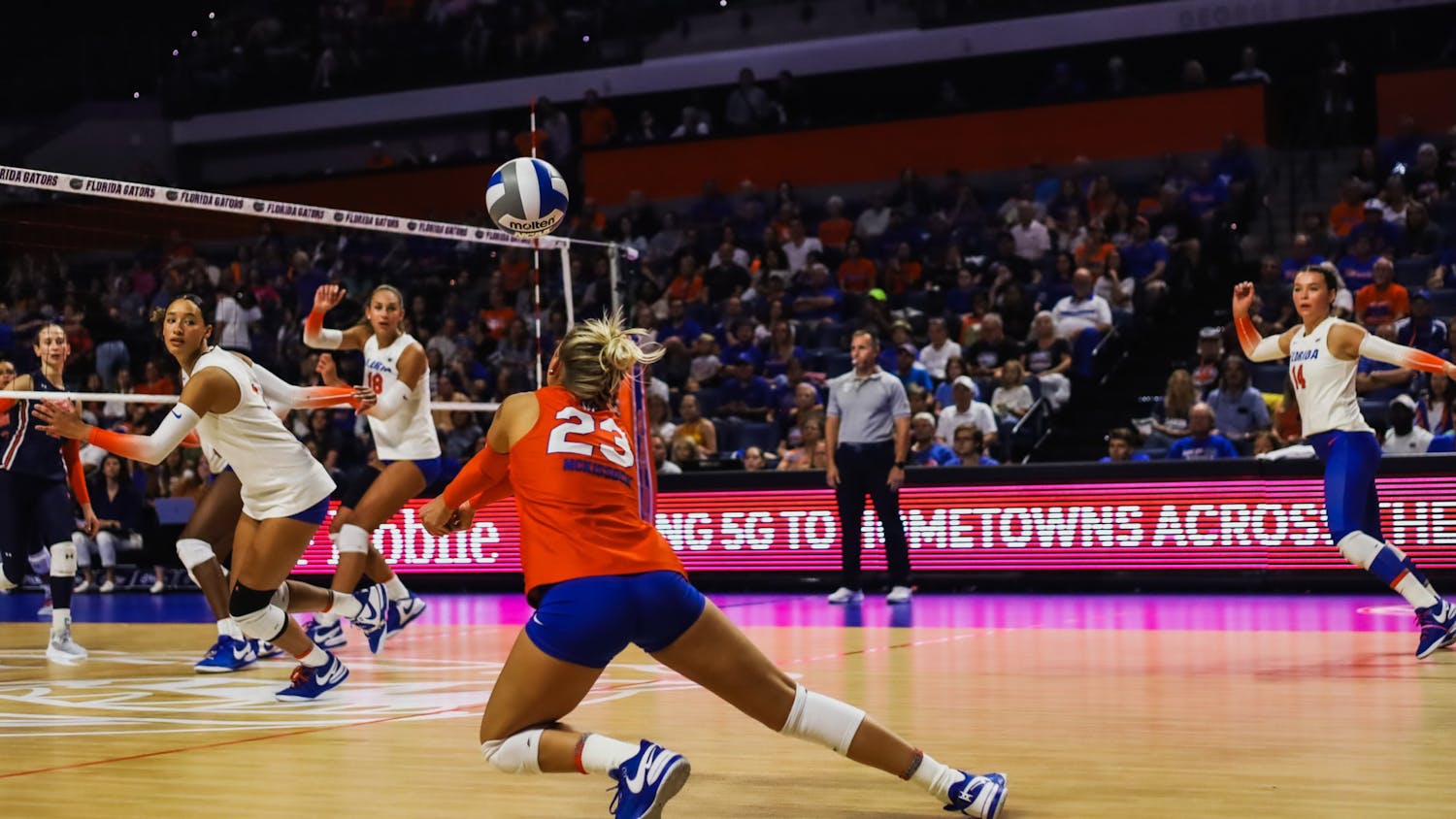 Senior libero Elli McKissock dives to set the ball in the Gators' 3-0 loss to the Auburn Tigers on Friday, Oct. 6, 2023.