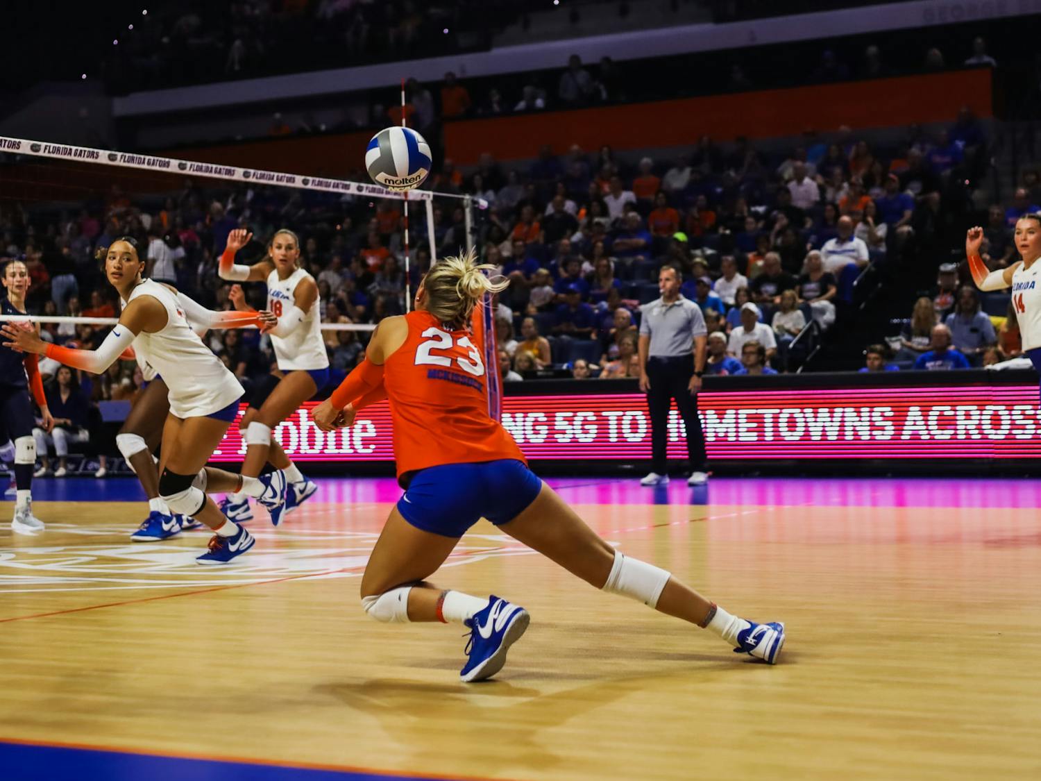 Senior libero Elli McKissock dives to set the ball in the Gators' 3-0 loss to the Auburn Tigers on Friday, Oct. 6, 2023.