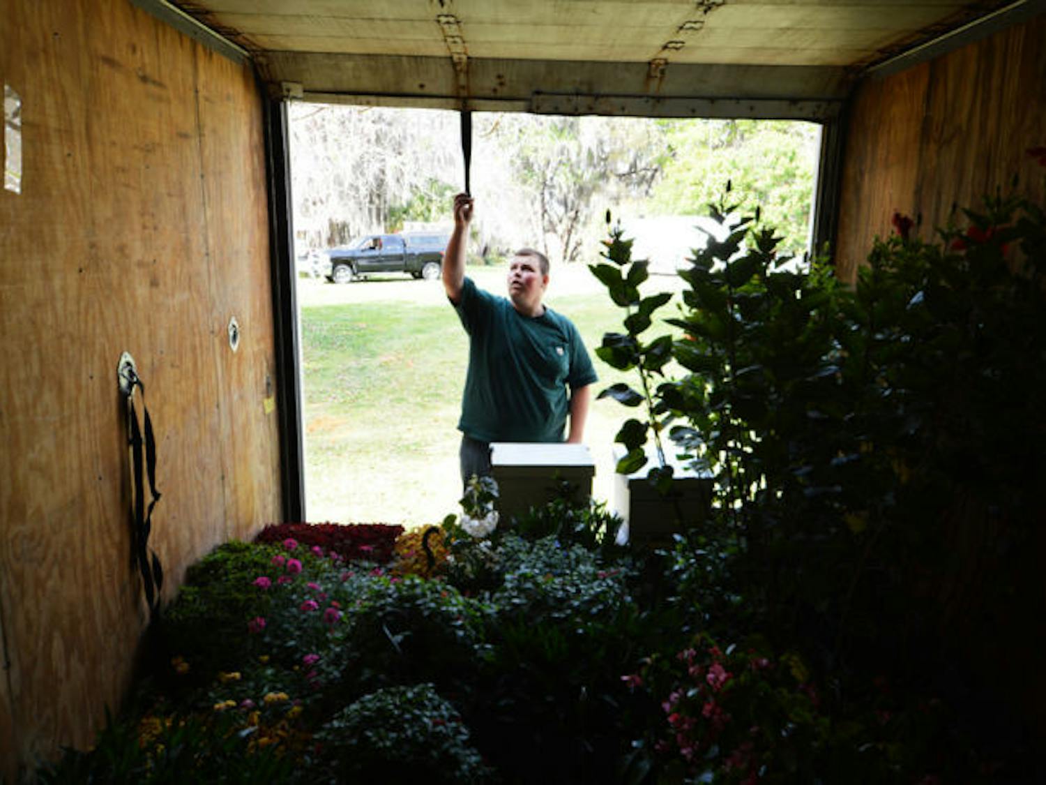 J.R. Trimm, 16, of Bronson, loads plants to his box truck at the Kanapaha Botanical Gardens on Thursday afternoon. This weekend is the Spring Festival at the gardens, located at 4700 SW 58th Drive.