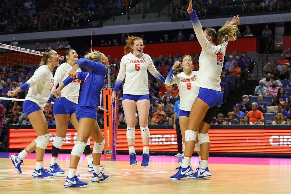 The Florida Gators volleyball team celebrate after bringing home a 3-0 win against No. 5 Minnesota on Sunday, Sept. 3, 2023.