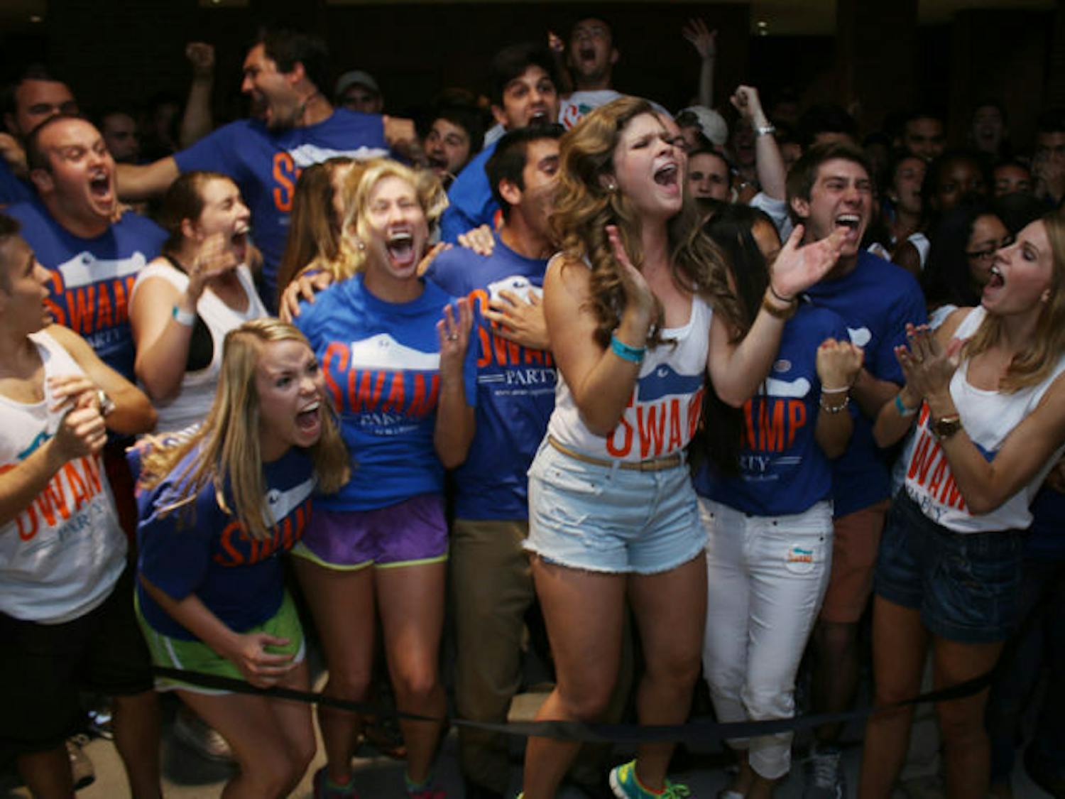 Senate President Lauren Verno, center, and other Swamp Party members celebrate winning 48 out of 50 seats in the Fall election Wednesday evening in the Reitz Union breezeway.