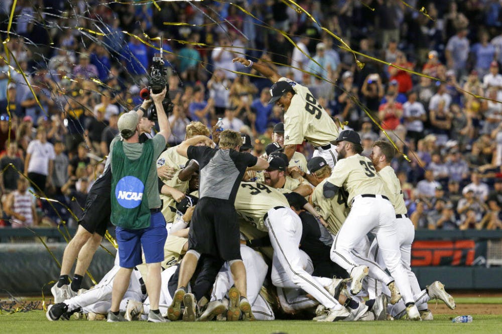 <p>FILE - In this June 26, 2019, file photo, Vanderbilt players celebrate winning Game 3 and the champinship of the NCAA College World Series baseball finals against Michigan in Omaha, Neb. If not for the coronavirus pandemic, there would have been a World Series championship series Omaha, Nebraska. (AP Photo/Nati Harnik, File)</p>