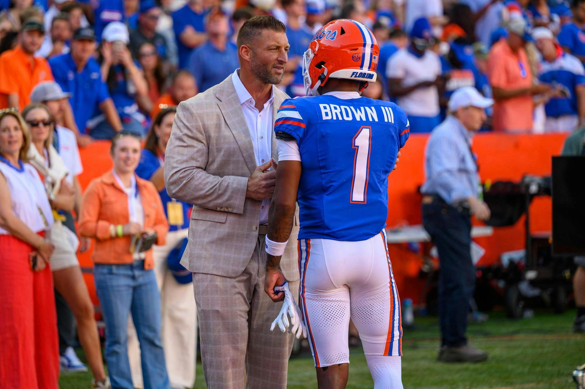 Tim Tebow speaks to Florida wide receiver Vernell Brown III (1) during the second half of an NCAA college football game against Ole Miss, Saturday, Sept. 26, 2026, in Gainesville, Fla.