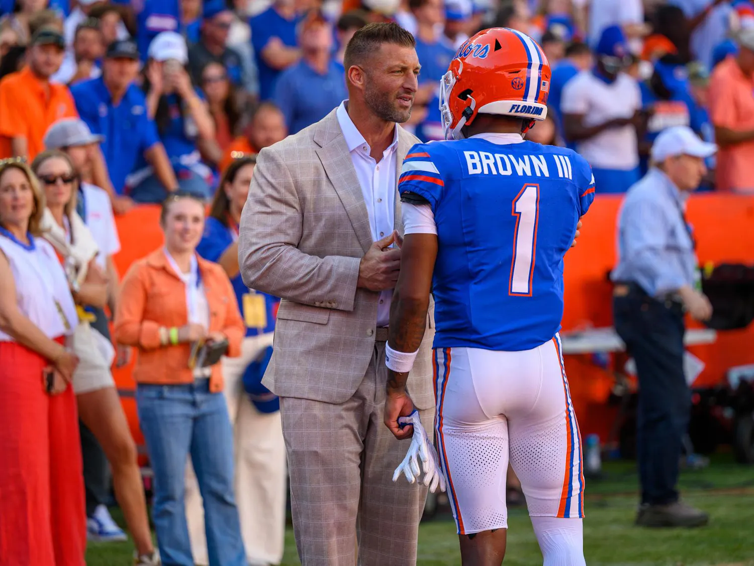 Tim Tebow speaks to Florida wide receiver Vernell Brown III (1) during the second half of an NCAA college football game against Ole Miss, Saturday, Sept. 26, 2026, in Gainesville, Fla.