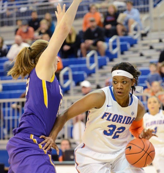 Senior forward Jennifer George dribbles in the lane during Florida's 77-72 win against LSU in the O'Connell Center.&nbsp;