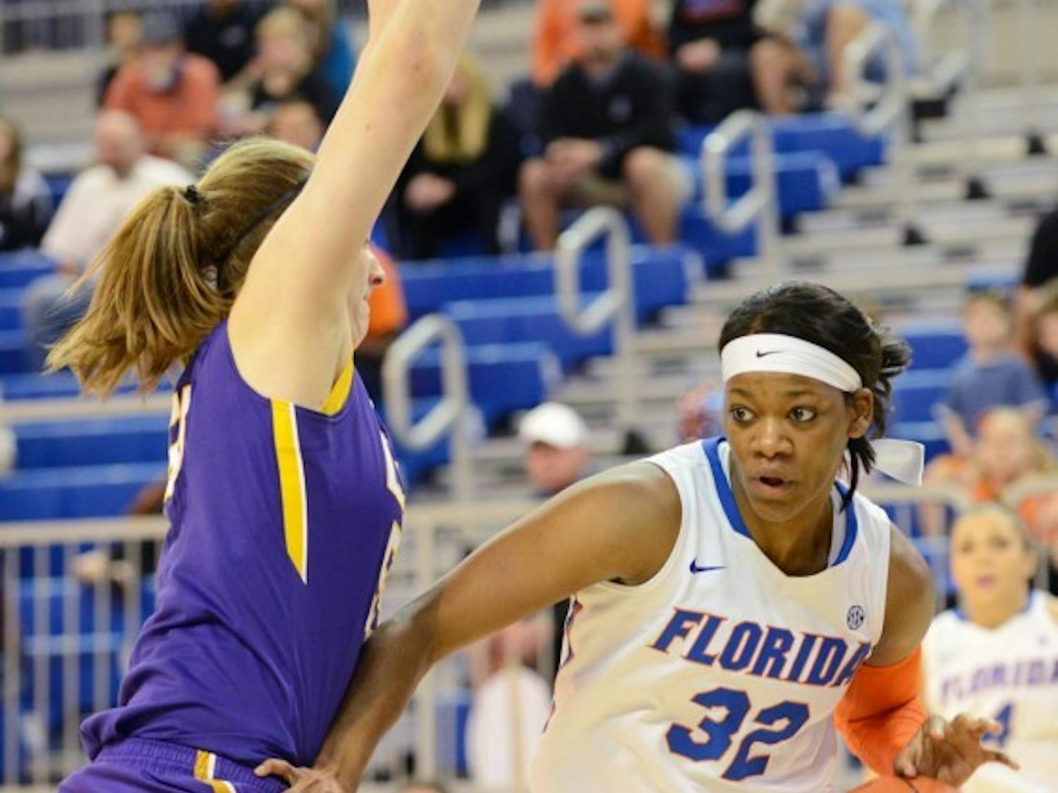 Senior forward Jennifer George dribbles in the lane during Florida's 77-72 win against LSU in the O'Connell Center.&nbsp;
