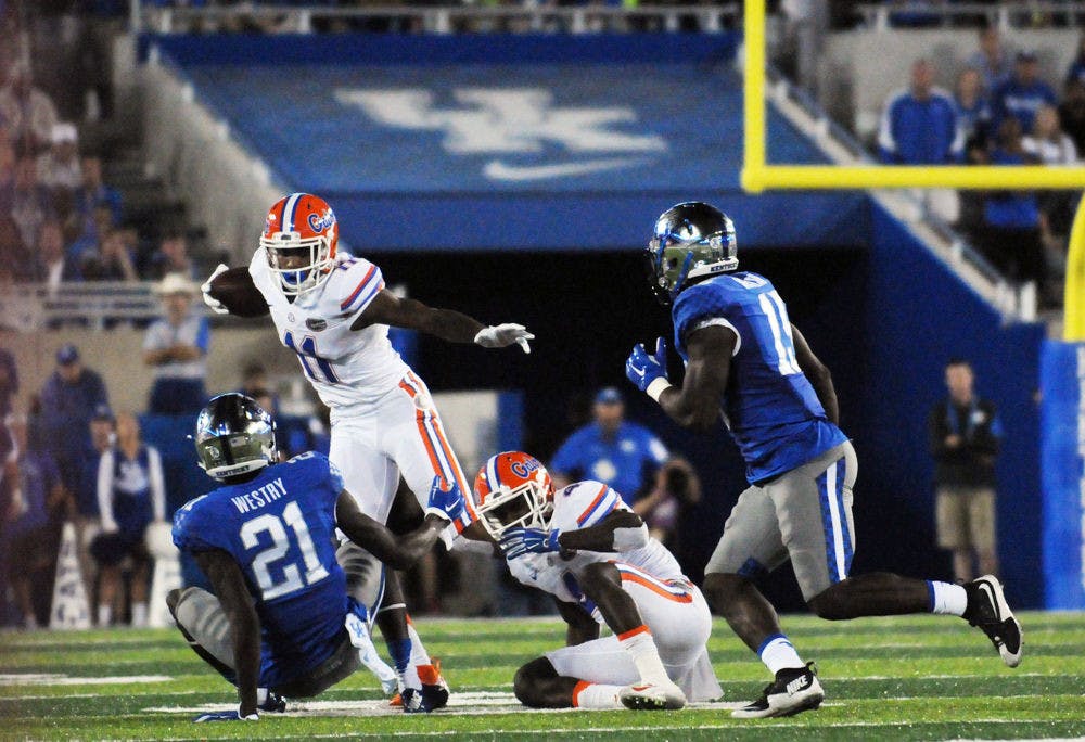 <p>UF wide receiver Demarcus Robinson attempts to elude a tackle during Florida's 14-9 win against Kentucky on Sept. 19, 2015, at Ben Hill Griffin Stadium.</p>