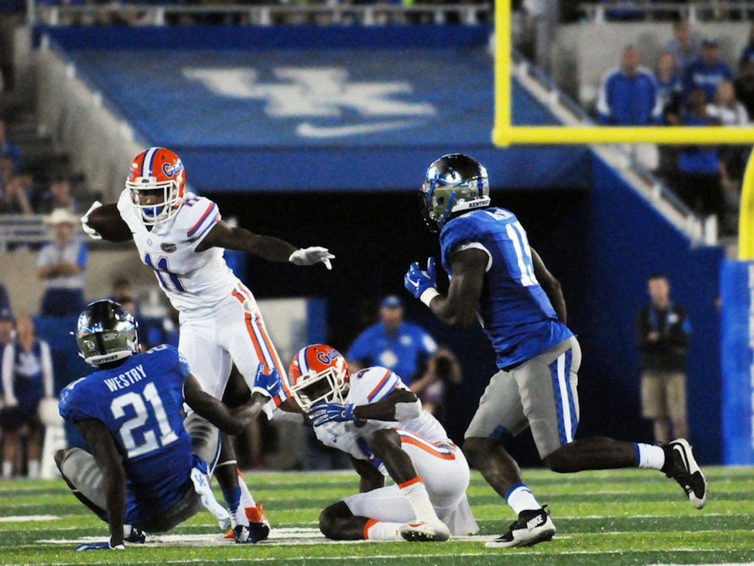 UF wide receiver Demarcus Robinson attempts to elude a tackle during Florida's 14-9 win against Kentucky on Sept. 19, 2015, at Ben Hill Griffin Stadium.