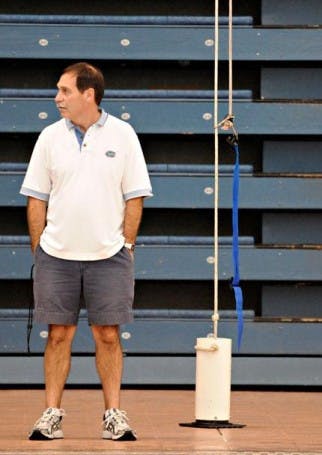 UF swim coach Gregg Troy watches his team's weight training at an early morning practice in the O'Connell Center on Feb. 7, 2008.&nbsp;