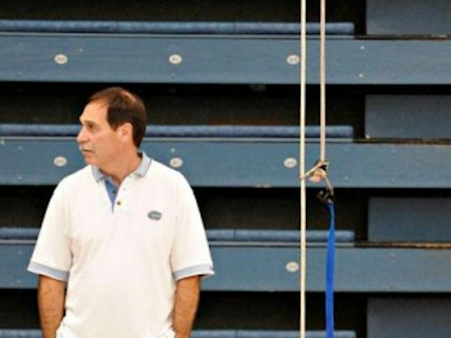 UF swim coach Gregg Troy watches his team's weight training at an early morning practice in the O'Connell Center on Feb. 7, 2008. 