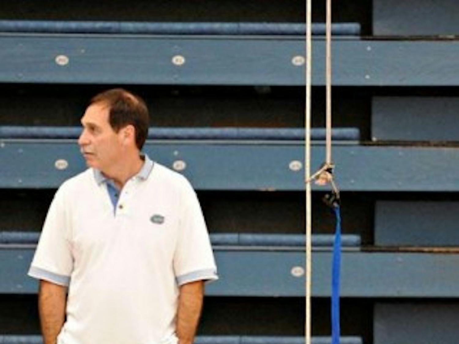 UF swim coach Gregg Troy watches his team's weight training at an early morning practice in the O'Connell Center on Feb. 7, 2008.&nbsp;