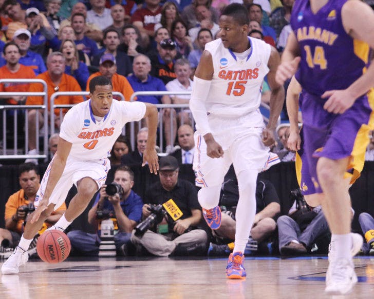 Kasey Hill drives down the court during Florida’s 67-55 win against Albany in the in the Amway Center in Orlando on Thursday. Hill scored 10 points in the second-round game of the NCAA Tournament against the Great Danes.