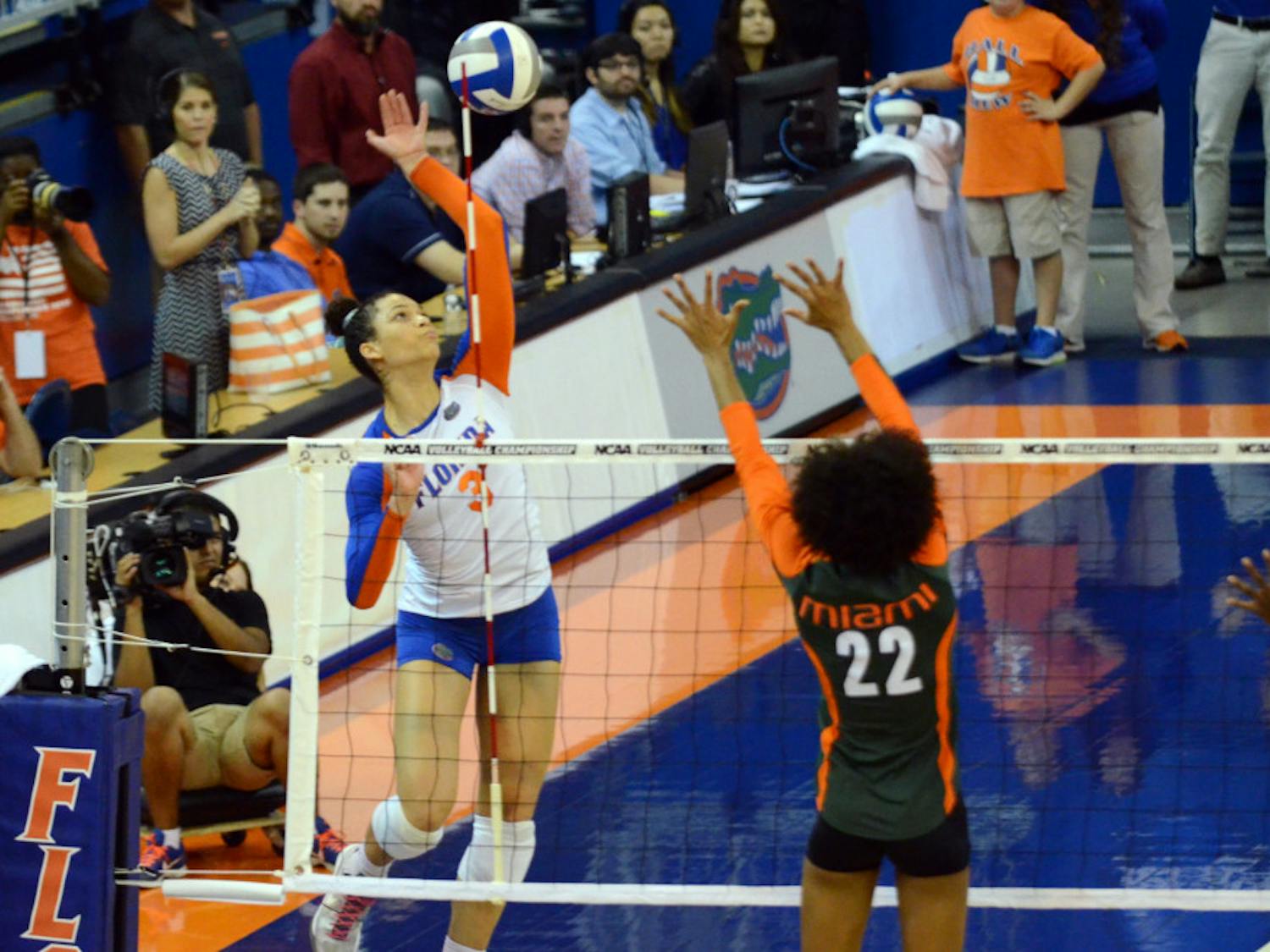 Sophomore right-side hitter Alex Holston swings for a kill attempt during No. 8 seed Florida's 3-1 win against Miami in the second round of the 2014 NCAA Tournament on Dec. 6 in the O'Connell Center.