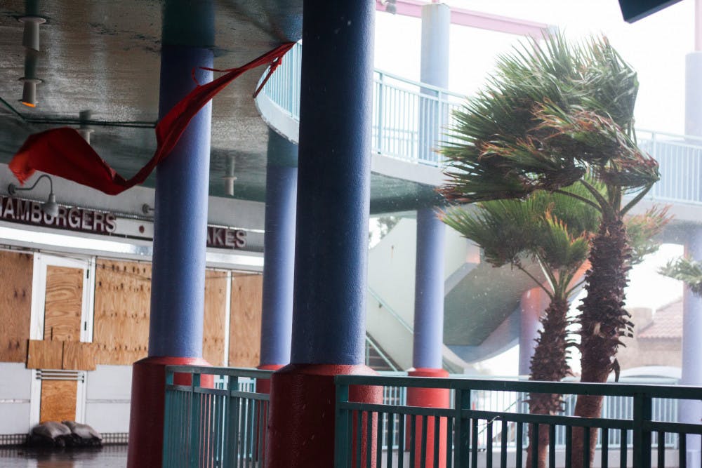 Part of an awning gets blown away at Ocean Walk Shoppes, an open-air shopping mall in Daytona Beach, as Hurricane Matthew makes its way through the area on Friday. The eye of Hurricane Matthew was, at one point, about 10 miles off the coast of Daytona Beach. 