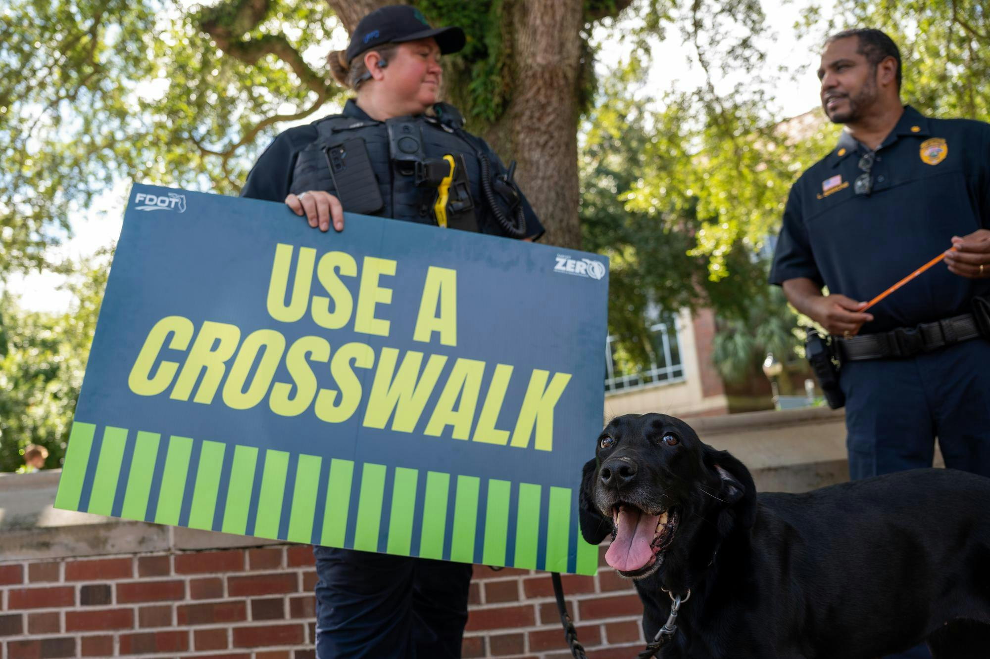 Signs urging pedestrians to use the crosswalk line the Newell Gateway, Monday, Aug. 31, 2026, in Gainesville, Fla.
