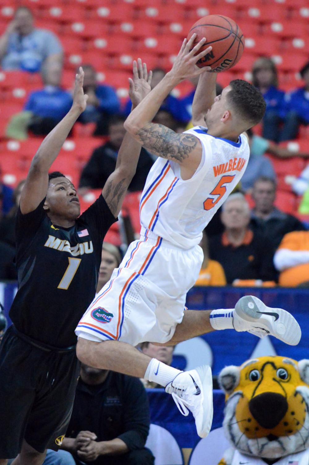 <p>Scottie Wilbekin attempts a layup during Florida's 72-49 win against Missouri on Friday in the Georgia Dome. The senior point guard scored 15 points against the Tigers.</p>