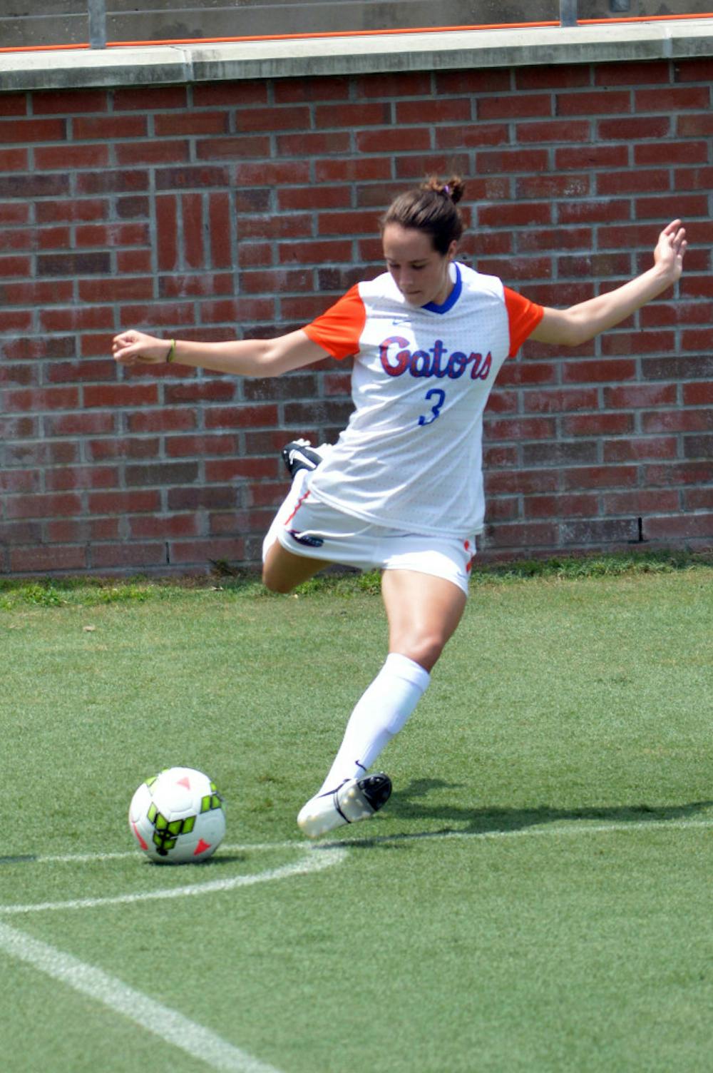 <p>Brooke Smith kicks a corner kick during Florida's 2-0 win against South Florida at Donald R. Dizney Stadium. Smith was one of four Gators to score a goal in Florida's 4-0 win against Oklahoma State on Sunday.</p>