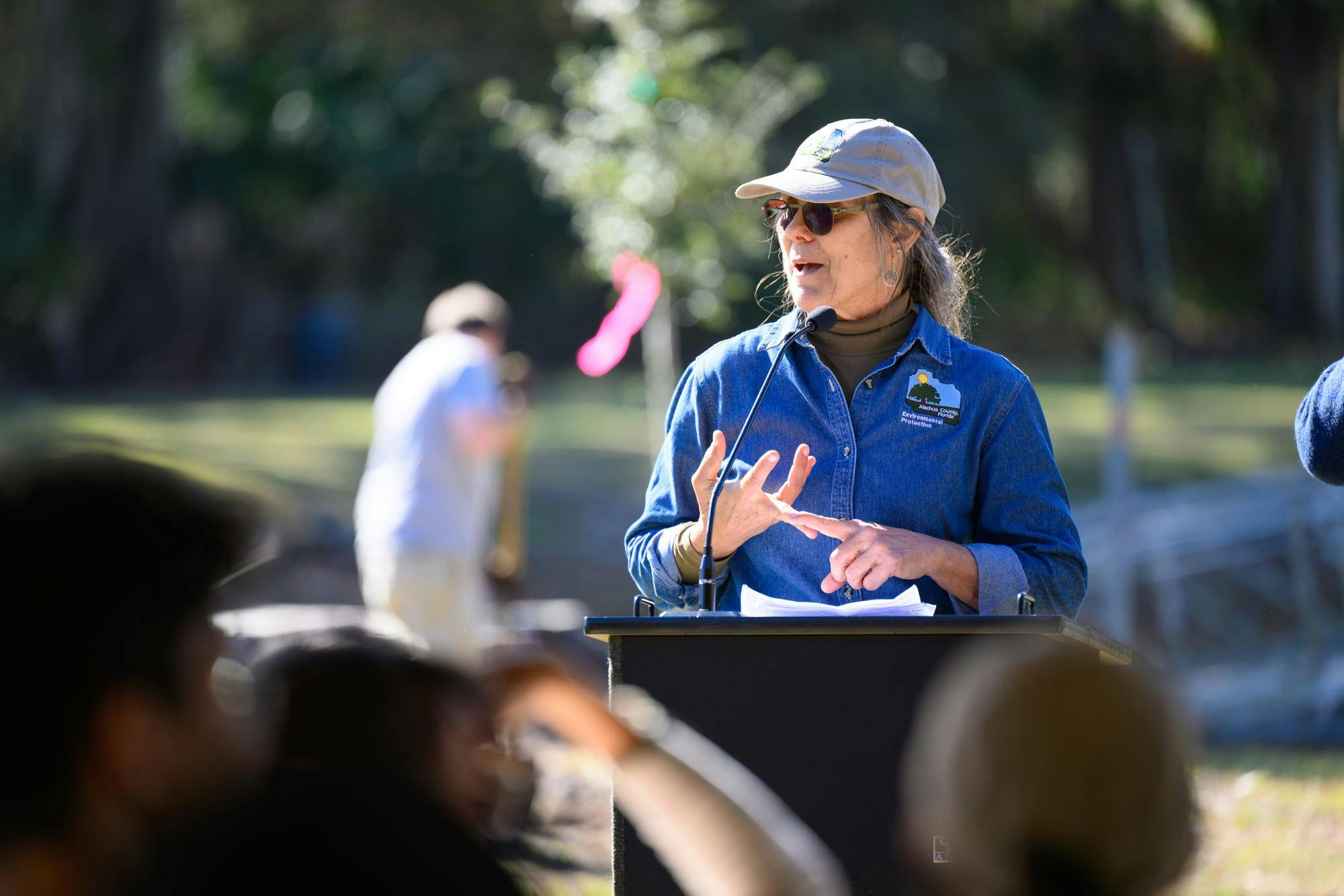 County Arborist Lacy Holtzworth speaks to a group of Arbor Day volunteers before a tree planting at Earl P. Powers Park in Gainesville, Fla., Saturday, Jan. 17, 2026.