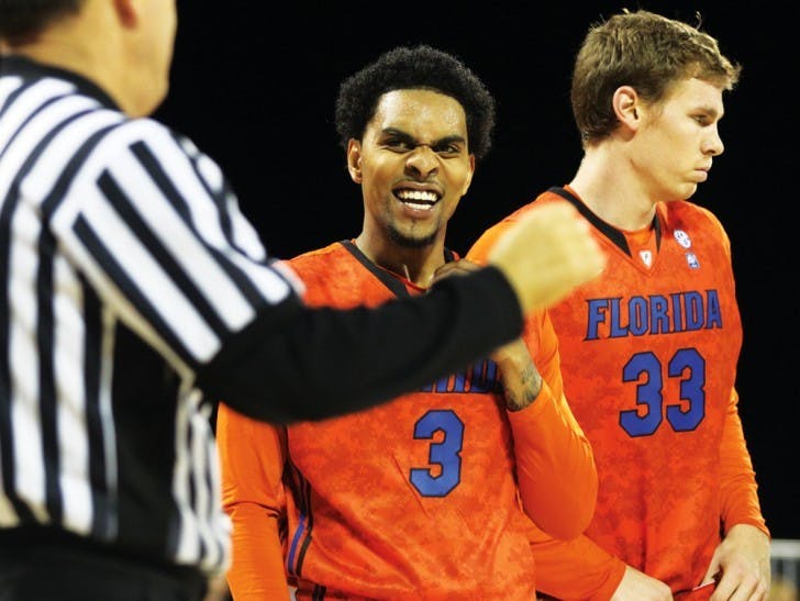 Senior guard Mike Rosario (3) laughs at an official while senior forward Erik Murphy (33) looks away during Florida’s game against Georgetown in the Navy-Marine Corps Classic on&nbsp; Nov. 9 aboard the USS Bataan in Jacksonville.&nbsp;
