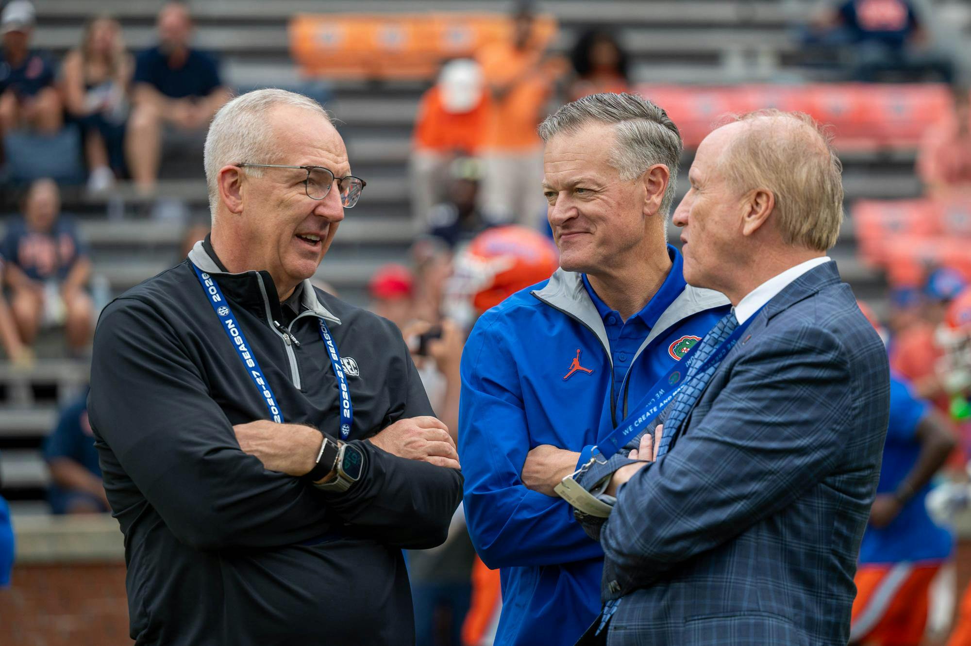 Florida athletic director Scott Stricklin, President Dr. Stuart Bell and SEC Commissioner Greg Sankey talk together before the first half of an NCAA college football game against Auburn, Saturday, Sept. 19, 2026, in Auburn, Ala.