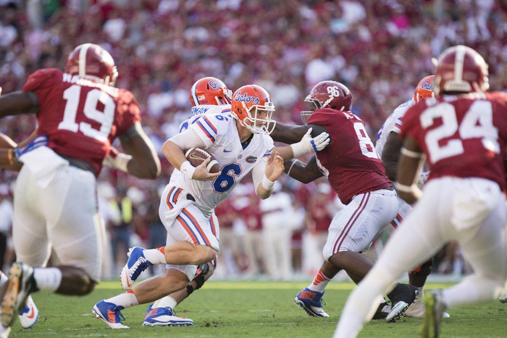 <p>Jeff Driskel rushes during Florida's 42-21 loss to Alabama on Sept. 20 at Bryant-Denny Stadium.</p>