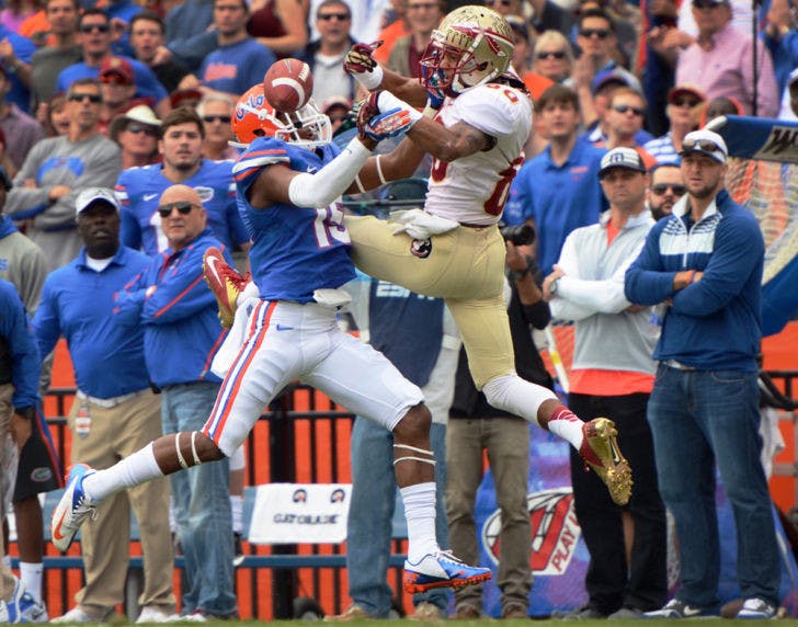 Loucheiz Purifoy blocks Florida State junior wide receiver Rashad Greene from an attempted pass during Florida’s 37-7 loss to Florida State on Saturday in Ben Hill Griffin Stadium.